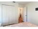 Bedroom with closet doors and neutral walls offers a cozy private space at 19227 Garden Quilt Cir, Lutz, FL 33558