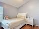 Cozy bedroom with neutral tones, plush bedding, and a window for natural light at 19227 Garden Quilt Cir, Lutz, FL 33558