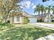 Charming single-Gathering home with a well-maintained lawn and a two-car garage at 19227 Garden Quilt Cir, Lutz, FL 33558