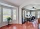 Bright home office with wood floors, neutral walls, and large windows offering plenty of natural light at 19227 Garden Quilt Cir, Lutz, FL 33558