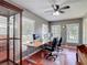 Bright office space features hardwood floors, natural light, a display case, and plenty of room to work at 19227 Garden Quilt Cir, Lutz, FL 33558