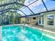 Beautiful screened-in pool area with comfortable outdoor seating and ample patio space for entertaining guests at 19227 Garden Quilt Cir, Lutz, FL 33558