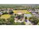 Aerial view showing an expansive recreation field, tennis courts, volleyball, playground, and community areas at 19227 Garden Quilt Cir, Lutz, FL 33558