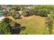 An aerial view of the community recreation field featuring a vast lawn, trees, and activity areas at 19227 Garden Quilt Cir, Lutz, FL 33558