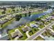 An aerial view of waterfront homes in a residential community at 2003 Wedge Ct, Sun City Center, FL 33573