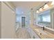Spacious bathroom with double vanities, granite countertops, and a walk-in closet at 2003 Wedge Ct, Sun City Center, FL 33573