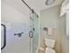 Modern bathroom with a glass-enclosed shower, white subway tile, and neutral paint at 2003 Wedge Ct, Sun City Center, FL 33573