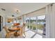 Dining area with outdoor view, tile flooring, and elegant furnishings at 2003 Wedge Ct, Sun City Center, FL 33573