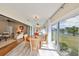 Bright dining area with an outdoor view featuring table and four chairs at 2003 Wedge Ct, Sun City Center, FL 33573