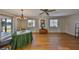 Bright dining area with hardwood floors, chandelier, and expansive windows overlooking the beautiful lake at 2003 Wedge Ct, Sun City Center, FL 33573