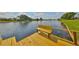 Beautiful waterfront view from a wooden dock with benches at 2003 Wedge Ct, Sun City Center, FL 33573