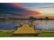 Waterfront property with a private wooden dock, ideal for relaxing by the water at 2003 Wedge Ct, Sun City Center, FL 33573