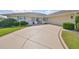 Close up of the home's driveway and manicured front lawn and landscaping at 2003 Wedge Ct, Sun City Center, FL 33573
