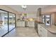 Updated kitchen featuring stainless steel appliances, granite countertops and a scenic view of the lake at 2003 Wedge Ct, Sun City Center, FL 33573