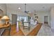 Open living room with vaulted ceiling and ceiling fans features views of the lanai at 2003 Wedge Ct, Sun City Center, FL 33573