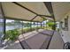 Relaxing screened patio with serene lake views and space for outdoor seating, perfect for enjoying the outdoors at 2003 Wedge Ct, Sun City Center, FL 33573