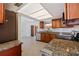 Well-equipped kitchen features granite countertops, stainless steel appliances, and wood cabinets at 2173 Dodge St, Clearwater, FL 33760