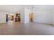 Spacious living room with tile flooring, a ceiling fan, and a view of the kitchen at 2173 Dodge St, Clearwater, FL 33760