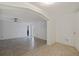 Open-concept living room with tile flooring, neutral walls, and ceiling fan at 2173 Dodge St, Clearwater, FL 33760