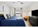 Cozy bedroom features a ceiling fan, a view from the window, and neutral-toned decor at 2250 64Th N St, St Petersburg, FL 33710
