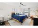 Bright bedroom with modern furniture, a ceiling fan, and a soothing color palette at 2250 64Th N St, St Petersburg, FL 33710