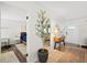 Bright entryway with a decorative plant, a view into the living room and bedroom, and a stylish rug at 2250 64Th N St, St Petersburg, FL 33710