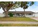 Charming single-story home with manicured front yard and mature trees, offering great curb appeal at 2250 64Th N St, St Petersburg, FL 33710