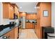 Well-equipped kitchen boasting granite countertops, wooden cabinets, and stainless steel appliances at 2250 64Th N St, St Petersburg, FL 33710