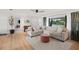 Stylish living room featuring hardwood floors, a large window, and neutral-toned furniture for a modern touch at 2250 64Th N St, St Petersburg, FL 33710