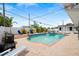 Enjoy this backyard pool, surrounded by a brick patio, tropical plants, and seating areas at 2250 64Th N St, St Petersburg, FL 33710