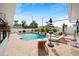 Relaxing backyard oasis with a sparkling pool, brick patio, and ample space for outdoor entertaining at 2250 64Th N St, St Petersburg, FL 33710