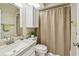 Clean bathroom with a shower, modern sink, and fresh green towel at 2537 Oakleaf Ln # 32A, Clearwater, FL 33763