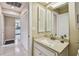 Well-maintained bathroom features a vanity with a granite countertop and tile flooring at 2537 Oakleaf Ln # 32A, Clearwater, FL 33763