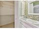 Bathroom view showcasing modern fixtures and a walk-in closet for ample storage at 2537 Oakleaf Ln # 32A, Clearwater, FL 33763