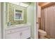 Bathroom features a decorative tiled backsplash and a sink with a white cabinet at 2537 Oakleaf Ln # 32A, Clearwater, FL 33763