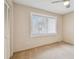 Bright, carpeted bedroom with neutral walls and natural light streaming through the window at 2537 Oakleaf Ln # 32A, Clearwater, FL 33763
