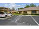 The exterior of this unit features guest parking, and well maintained landscaping at 2537 Oakleaf Ln # 32A, Clearwater, FL 33763