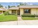 Charming single-story home featuring a well-manicured lawn and inviting entrance at 2537 Oakleaf Ln # 32A, Clearwater, FL 33763
