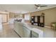 Spacious living room with tile flooring, dining area, and a ceiling fan at 2537 Oakleaf Ln # 32A, Clearwater, FL 33763