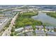 Stunning aerial view showcasing the community, with serene lakes, lush greenery, and well-placed townhomes at 2547 Lexington Oak Dr, Brandon, FL 33511