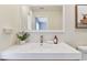Clean bathroom featuring a floating vanity, modern fixtures, and a decorative print above the toilet at 2547 Lexington Oak Dr, Brandon, FL 33511