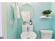 Charming bathroom featuring a unique round sink, a modern mirror, and soft blue walls at 2547 Lexington Oak Dr, Brandon, FL 33511