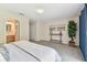 Spacious bedroom featuring carpeted floors, neutral paint, and ensuite bathroom at 2547 Lexington Oak Dr, Brandon, FL 33511