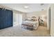 Comfortable bedroom with a barn door, soft carpet, and a sliding glass door at 2547 Lexington Oak Dr, Brandon, FL 33511