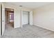 Comfortable bedroom features neutral walls, plush carpeting, and a spacious closet for ample storage at 2547 Lexington Oak Dr, Brandon, FL 33511