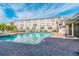Large community pool with brick paver surround and lots of sun loungers and palm trees at 2547 Lexington Oak Dr, Brandon, FL 33511