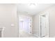 Bright hallway with carpet flooring and views to the bedrooms at 2547 Lexington Oak Dr, Brandon, FL 33511