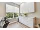 Kitchen nook with white cabinets, granite countertops, and a large window that allows plenty of natural light at 2547 Lexington Oak Dr, Brandon, FL 33511