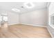 Open living area featuring bright wood floors, recessed lighting, and contemporary design at 2547 Lexington Oak Dr, Brandon, FL 33511