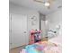 Bright bedroom with a ceiling fan, and a pink wardrobe for plenty of storage at 2708 W North B St # 3, Tampa, FL 33609